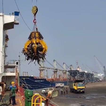 Ship grab bucket mounted on crane